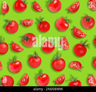 Fresh tomatoes on green background. Pattern design Stock Photo