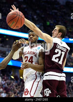 Oklahoma guard Buddy Hield left passes around Texas A M guard