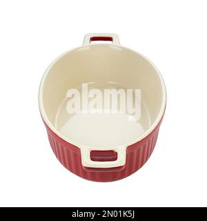 Red ceramic baking dish on a white background. Empty oval baking dish for gratin. File contains clipping path. Stock Photo