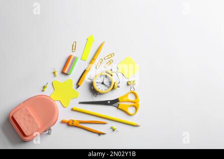 Flat lay composition with school stationery on white background, space for text. Back to school Stock Photo