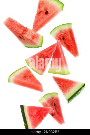 Fresh watermelon pieces falling on white background Stock Photo