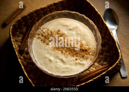 Rice pudding is a typical dessert of the gastronomy of many countries made by slowly cooking rice pudding and sugar. Stock Photo