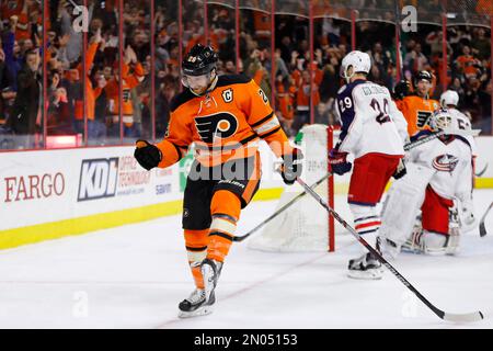 Philadelphia Flyers' Claude Giroux celebrates his 2nd period goal with  teammates Andrej Meszaros (center) and Braydon Colburn during the 2nd  period of the 2012 Winter Classic at Citizens Bank Park in Philadelphia