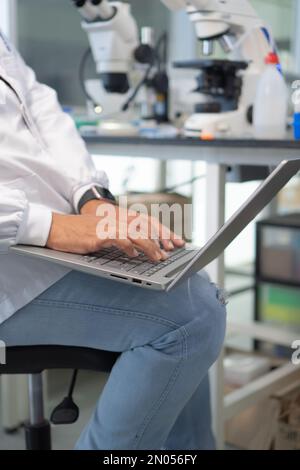 Close-up of a scientist using a laptop computer in the laboratory Stock Photo