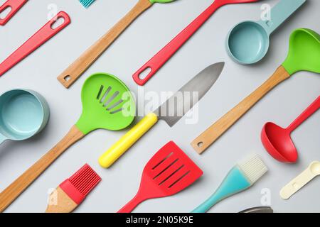 Set of modern cooking utensils on light background, flat lay Stock Photo