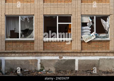 Windows damaged after shelling (close-up). War in Ukraine. Russian invasion of Ukraine. Terror of the civilian population. War crimes Stock Photo