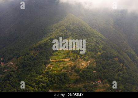 Drone photography of small italian mountain village and terrace farms during summer day Stock Photo