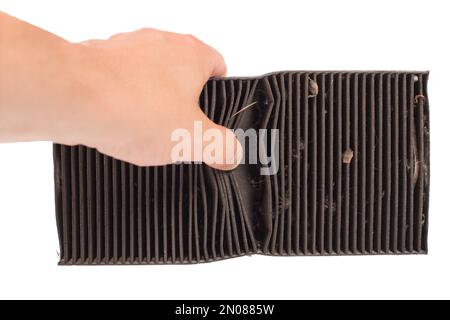 Showing in hands old car air filter close up. Dirt air conditioning filter. Stock Photo