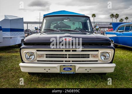 Daytona Beach, FL - November 26, 2022: Low perspective front view of a 1962 Ford F100 Stepside Pickup Truck at a local car show. Stock Photo