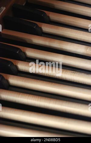 Old wood foot pedals on a medieval organ. Stock Photo