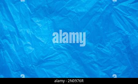 Blue and crumpled plastic bag background and texture. Stock Photo