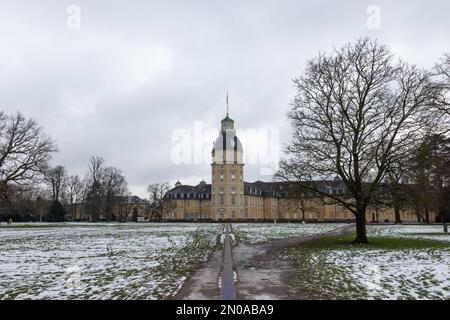 Karlsruhe schloss palace seen from the read castle garden after a snowy winter day. Stock Photo