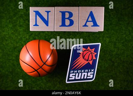 January 30, 2023, Springfield, USA. The emblem of the Phoenix Suns National Basketball Association club on the green lawn of the stadium. Stock Photo