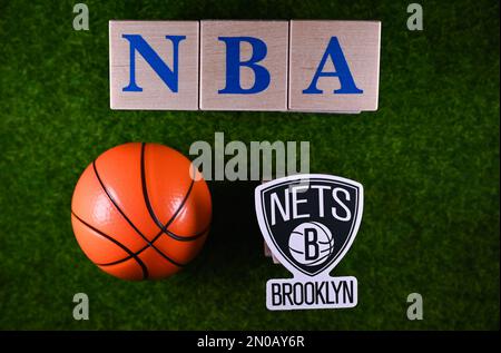 January 30, 2023, Springfield, USA. The emblem of the Brooklyn Nets National Basketball Association club on the green lawn of the stadium. Stock Photo