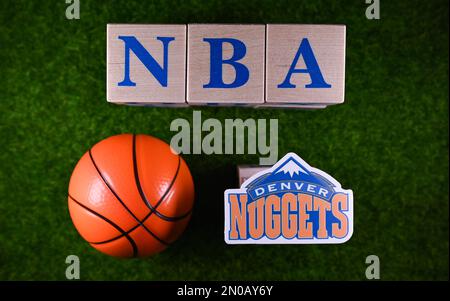 January 30, 2023, Springfield, USA. The emblem of the Denver Nuggets National Basketball Association club on the green lawn of the stadium. Stock Photo