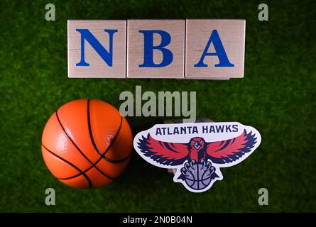 January 30, 2023, Springfield, USA. The emblem of the National Basketball Association club Atlanta Hawks on the green lawn of the stadium. Stock Photo