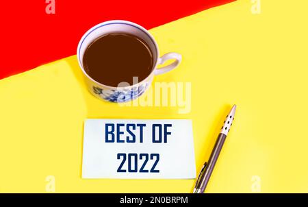 best of 2022 - handwriting on sticker and red yellow background, product or business review for the last year Stock Photo