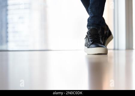 Trendy casual footwear on male feet close up shot Stock Photo