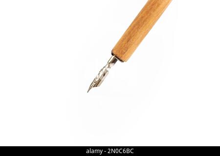 Dip nib ink pen isolated on white background, soft focus close up Stock Photo