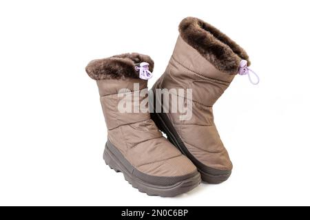 child winter boots, brown colored, isolated on white background Stock Photo