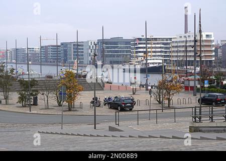 Bremerhaven, Germany - October 21, 2018: Historic steam ice breaker ship Wal in front of modern apartment buildings fall day. Stock Photo