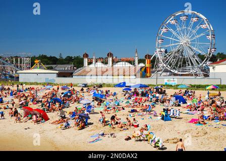 A crowded beach scene on a sunny day in Old Orchard Beach, Maine Stock Photo