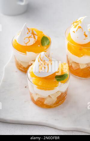 Orange pound cake trifle with cream cheese mousse, orange marmalade and fresh orange slices Stock Photo