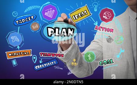 Business plan. Man pointing at virtual screen with different icons, closeup Stock Photo