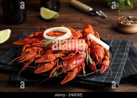 Delicious red boiled crayfishes on table, closeup Stock Photo