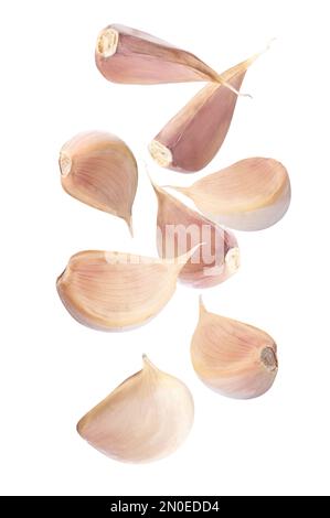 Fresh garlic cloves falling on white background Stock Photo - Alamy