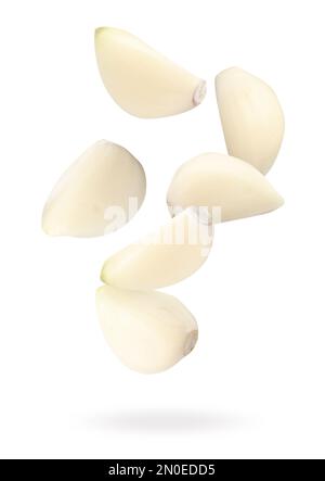 Many garlic cloves falling on white background Stock Photo - Alamy