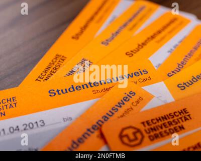 Student Identity Cards (Studentenausweis) lying on each other. Different campus cards for identification at the university. Studying at a university. Stock Photo