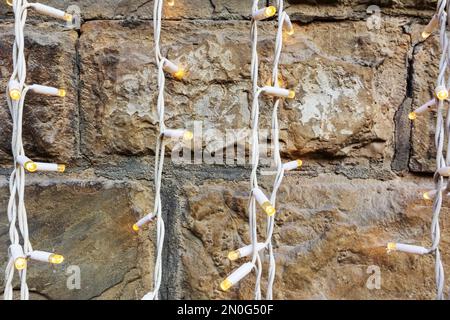 Brown brick wall with vertical light strips Stock Photo