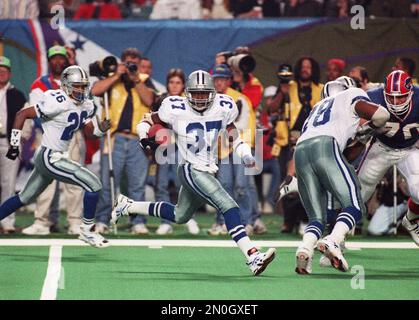 Dallas Cowboys' Emmitt smith (22) is congratulated by his goddaughter  Kendra, after the Cowboys beat the Bills 30-13, in Super Bowl XXVIII at the  Georgia Dome in Atlanta, Jan. 30, 1994. The