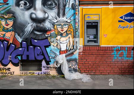 14.04.2022, Berlin, Germany, Europe - Graffiti on a wall next to an ATM near Mauerpark in East Berlin's Prenzlauer Berg locality. Stock Photo