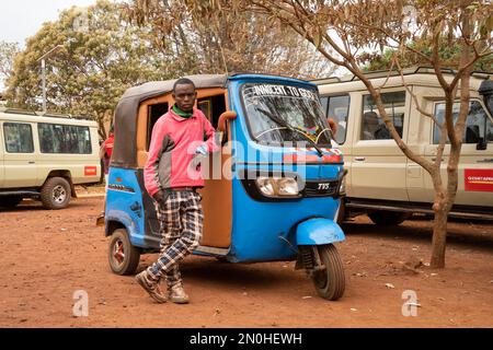 Karatu, Tanzania - October 16th, 2022: A driver waiting for passengers by the FAME medical health center, located in Karatu, Tanzania. Stock Photo