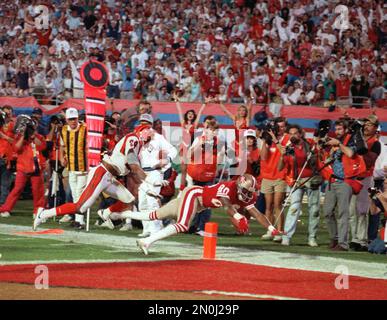 NFL FILE: Jerry Rice (80) and Steve Young (8) of the San Francisco 49ers  during Super Bowl XXIX at Joe Robbie Stadium in Miami, Florida. Young threw  a record 6 touchdowns and