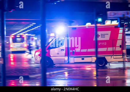 Ambulance on alarm, DRK, Essen fire brigade, rainy weather, city centre, in the evening, Essen, NRW, Germany, Stock Photo