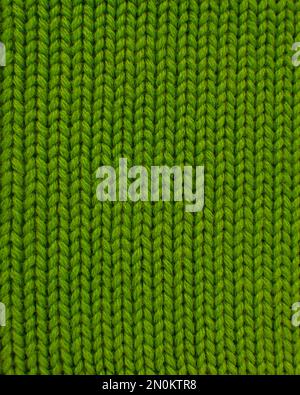 Woolen green knitted warm texture fabric background Stock Photo