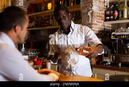 Bartender making cocktail Stock Photo