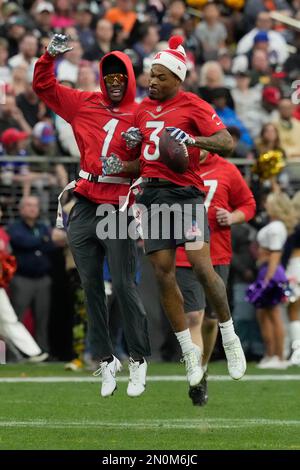 AFC strong safety Derwin James (3) of the Los Angles Chargers celebrates  with AFC cornerback Sauce Gardner (1) of the New York Jets during the flag  football event at the Pro Bowl