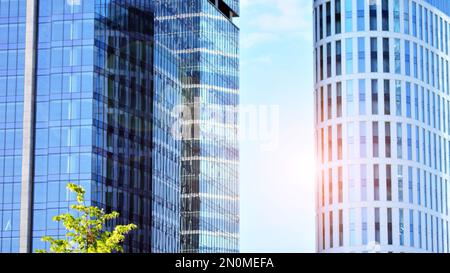 Downtown corporate business district architecture. Glass reflective office buildings against blue sky and sun light. Economy, finances, business Stock Photo