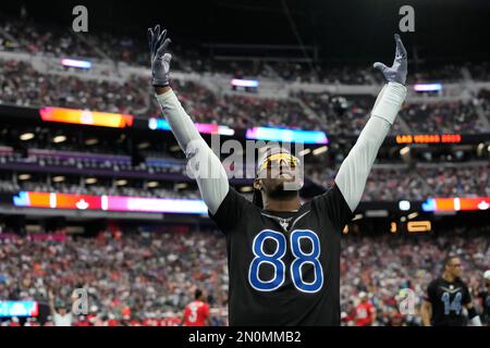 NFC wide receiver CeeDee Lamb of the Dallas Cowboys tosses a ball to a  teammate during Pro Bowl NFL football practice, Friday, February 4, 2022,  in Las Vegas. (Gregory Payan/AP Images for