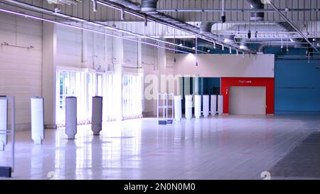 Supermarket going out of business. Interior of a closed big supermarket. Stock Photo