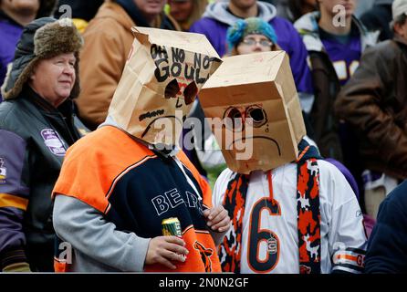 Chicago Bears fans wear paper bags on their heads in the closing