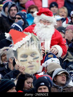 A Tennessee Titans fan is dressed as Santa as he watches the Titans play  the San Diego Chargers in the second quarter of an NFL football game on  Friday, Dec. 25, 2009