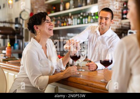 Two female friends in the bar Stock Photo