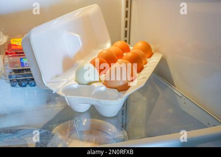 box of Fresh free range Chickens  eggs in a fridge Stock Photo
