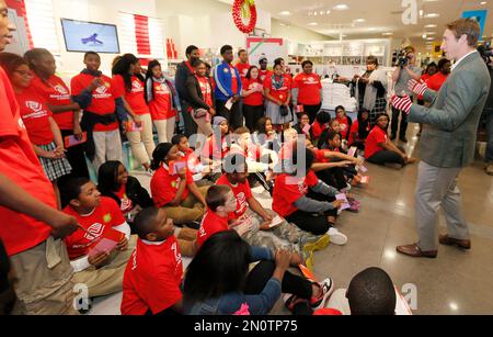 IMAGE DISTRIBUTED FOR JCPENNEY - Dallas Cowboys linebacker Sean Lee, left,  shops alongside Ajion Lair, 18, from the Boys & Girls Club of Greater Dallas  as he selects gifts for his family