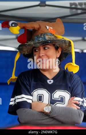 Young Dallas Cowboys fans wear turkey hats before an NFL football